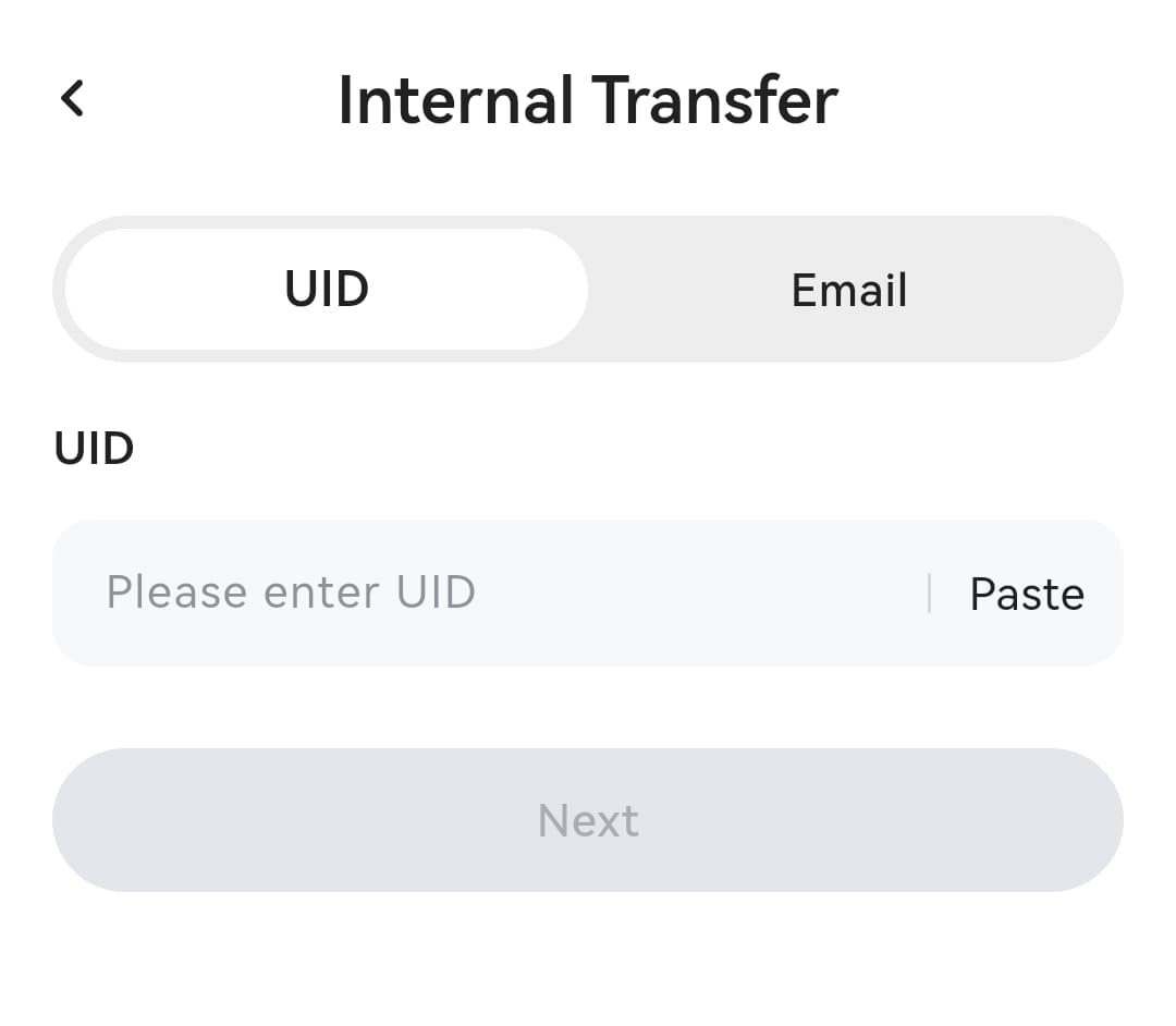 DogPay internal transfer screen with UID and Email tabs and an input field for the recipient identifier