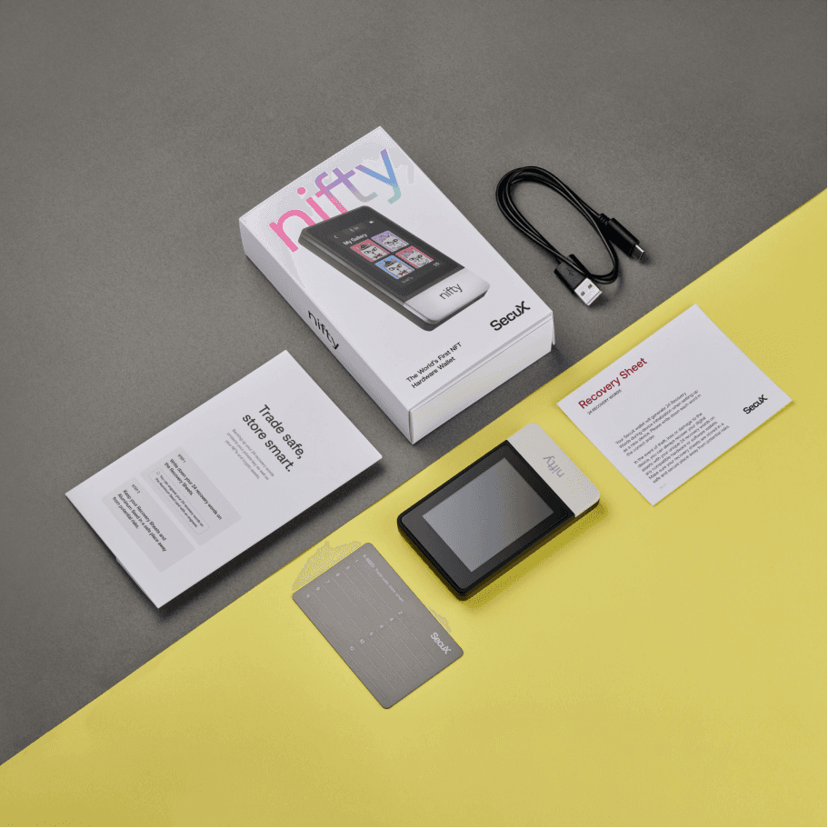 SecuX Nifty hardware wallet box with the device, cable, and recovery sheet